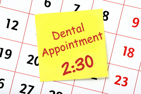 calendar with dental appointment on a post it